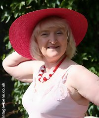 a light-haired older damsel is toying with her breasts and she has a giant man meat